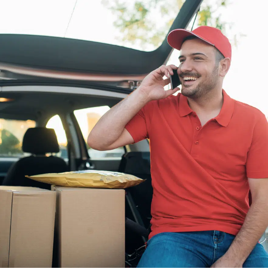 Happy male customer service agent in a call center