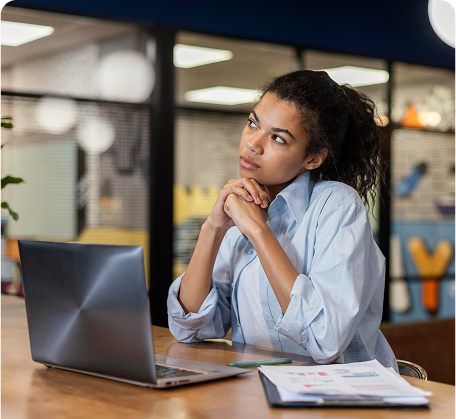 pensive woman office with laptop